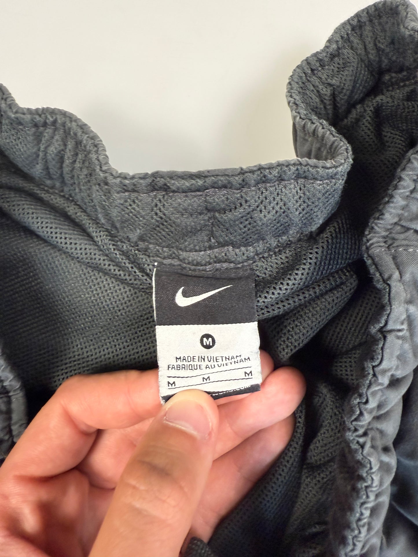 Vintage Nike spell out track pants (M)