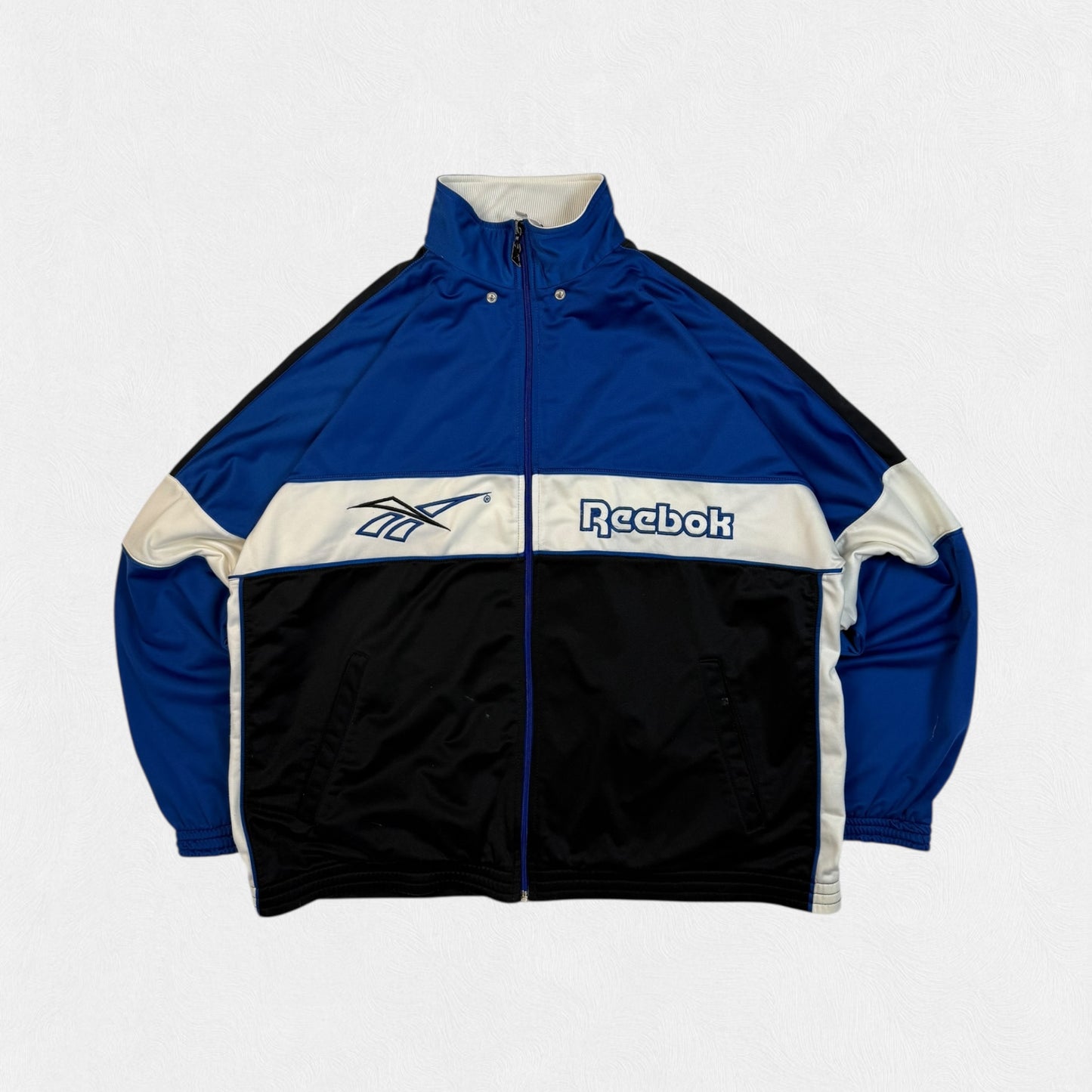 Vintage 90s Reebok spell out track jacket (L)