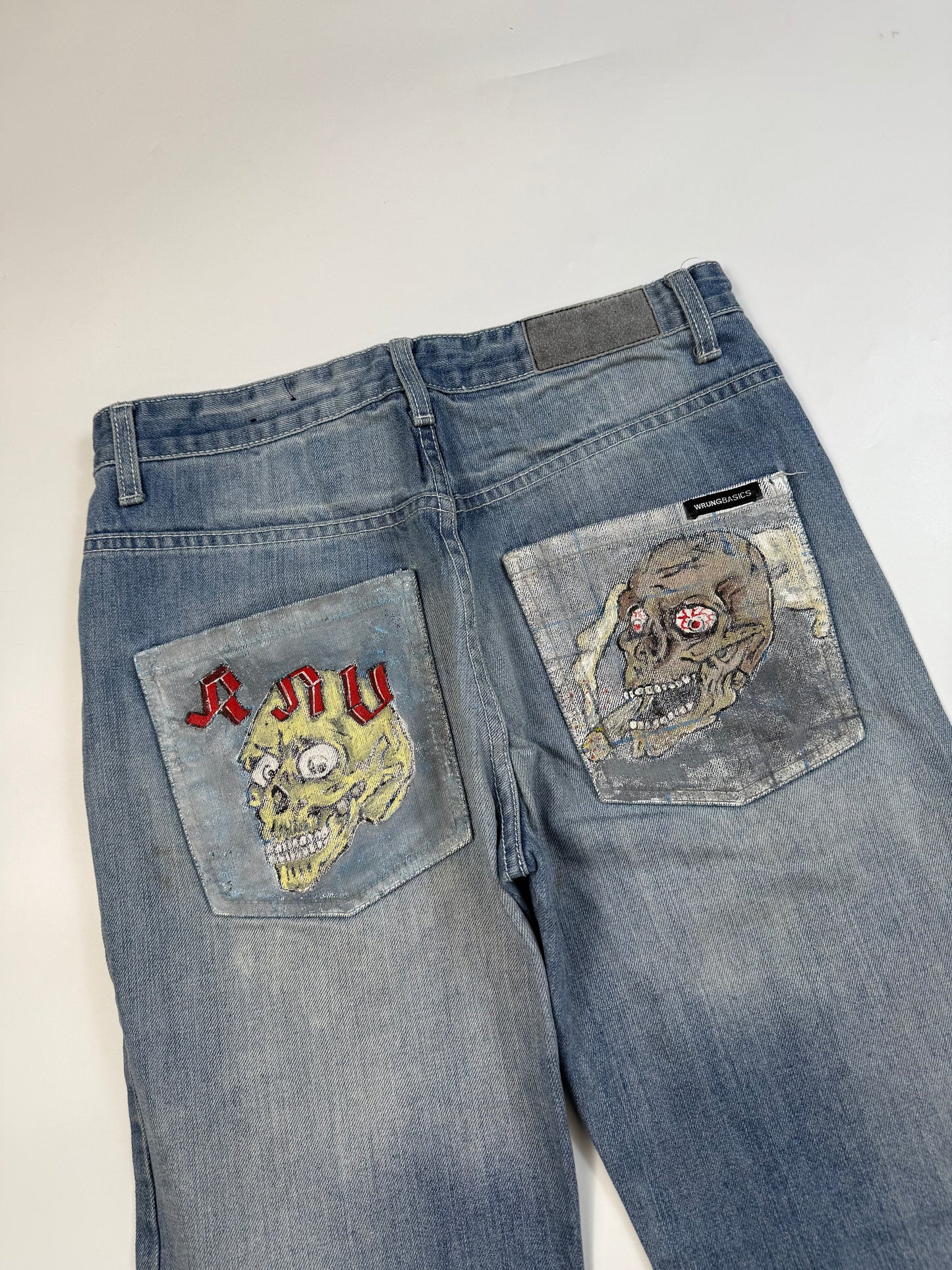 Vintage Y2K Skull logo denim jeans (W30)