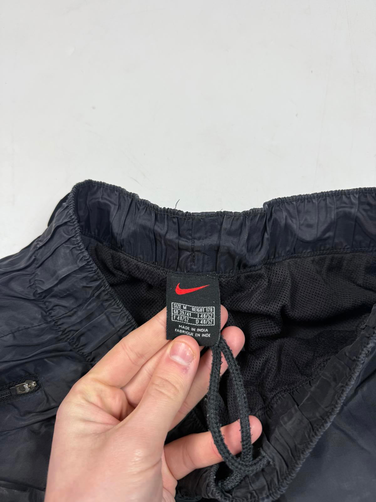 Vintage 90s Nike mini swoosh baggy track pants (M)