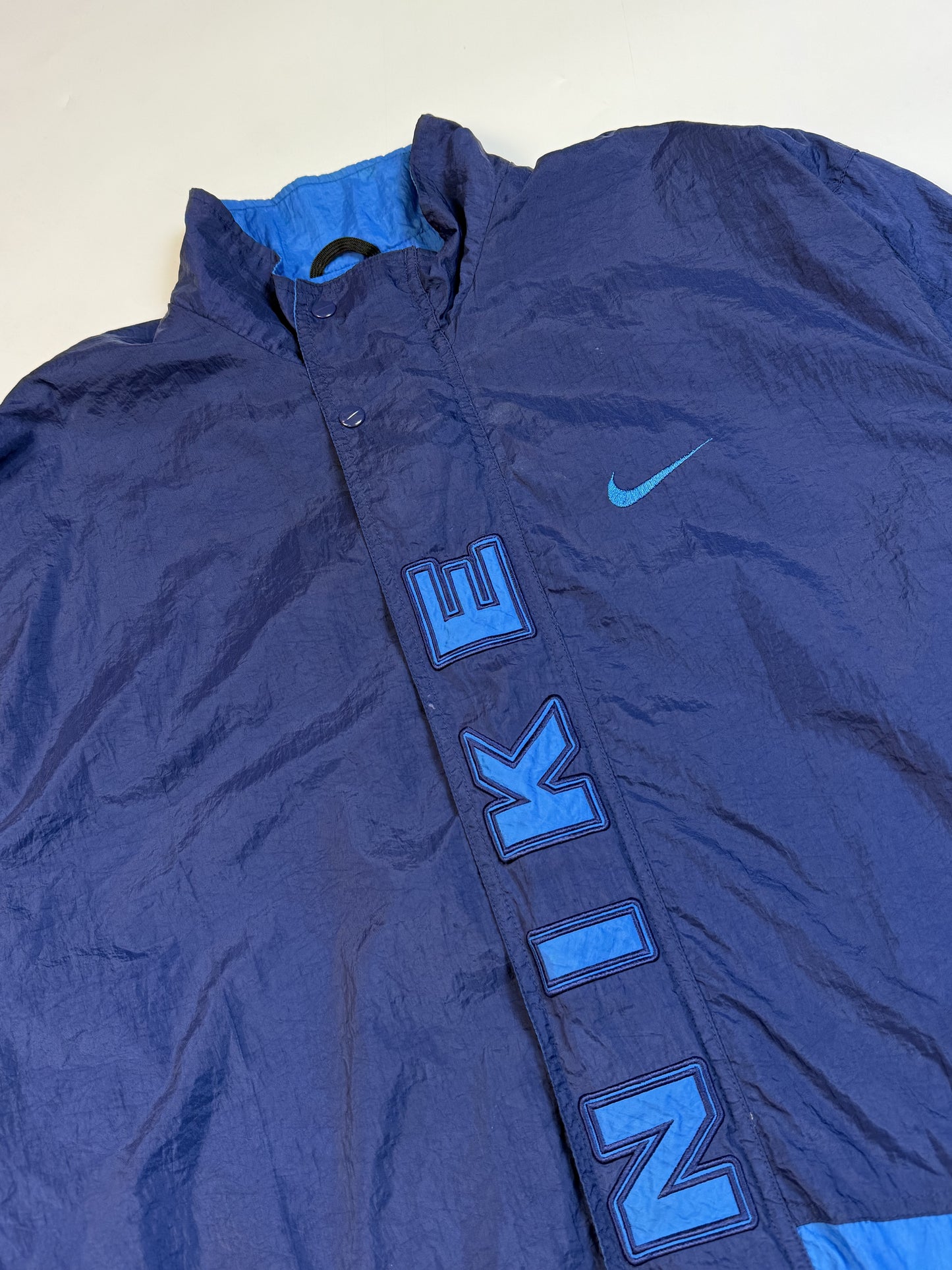 Vintage 90s Nike spell out windbreaker jacket (XL)