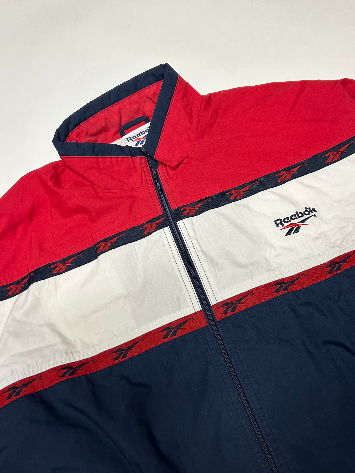 Vintage 90s Reebok spell out track jacket (L)
