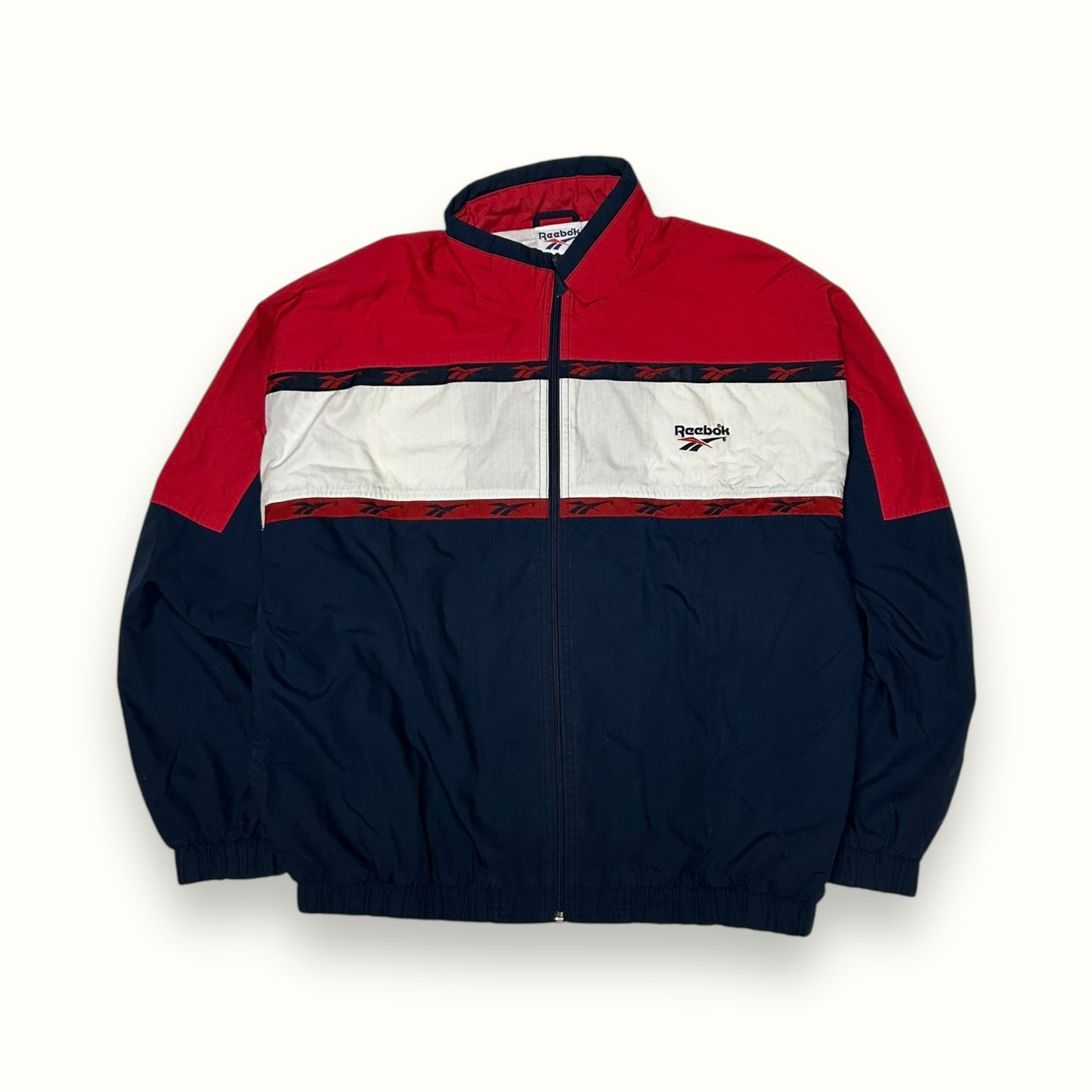 Vintage 90s Reebok spell out track jacket (L)