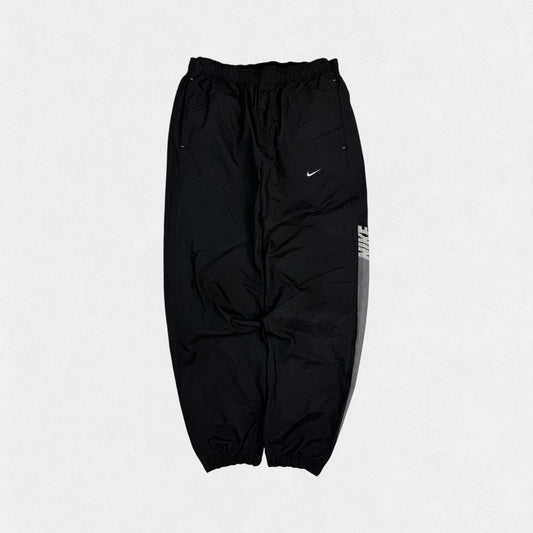 Vintage Nike spell out baggy track pants (M)