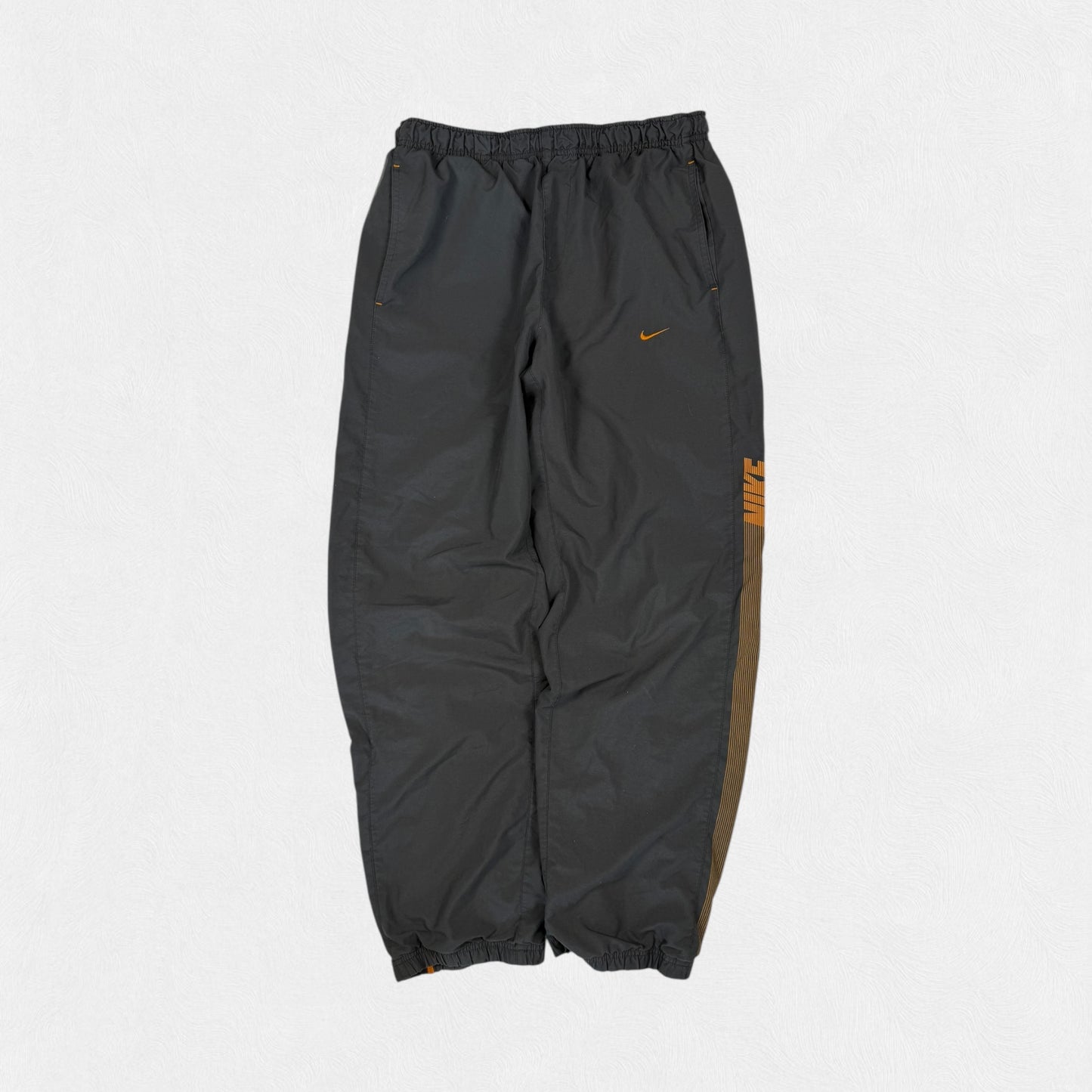 Vintage Nike spell out track pants (M)